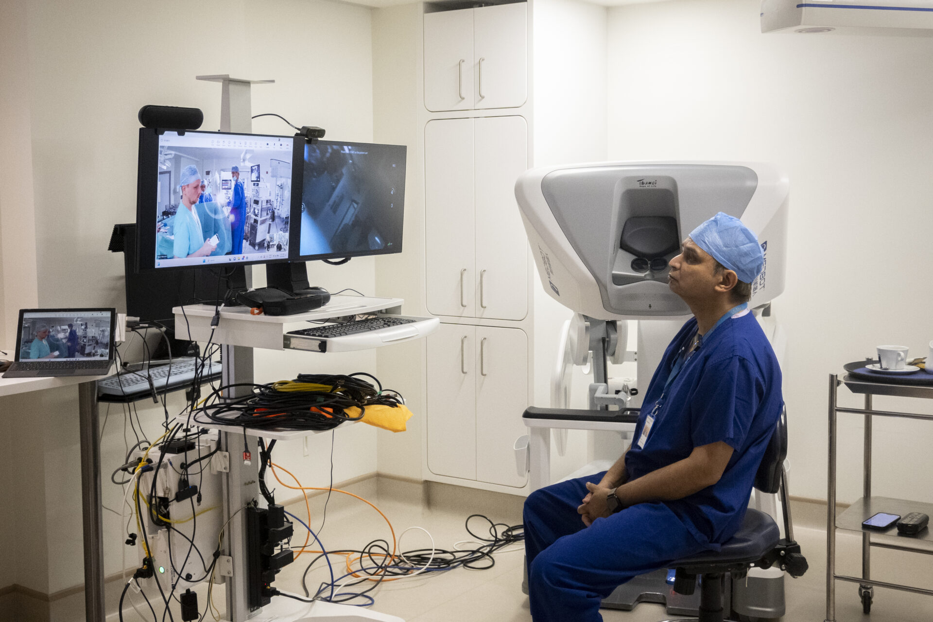 A consultant surgeon consulting with a patient about prostate cancer treatment options in the UK