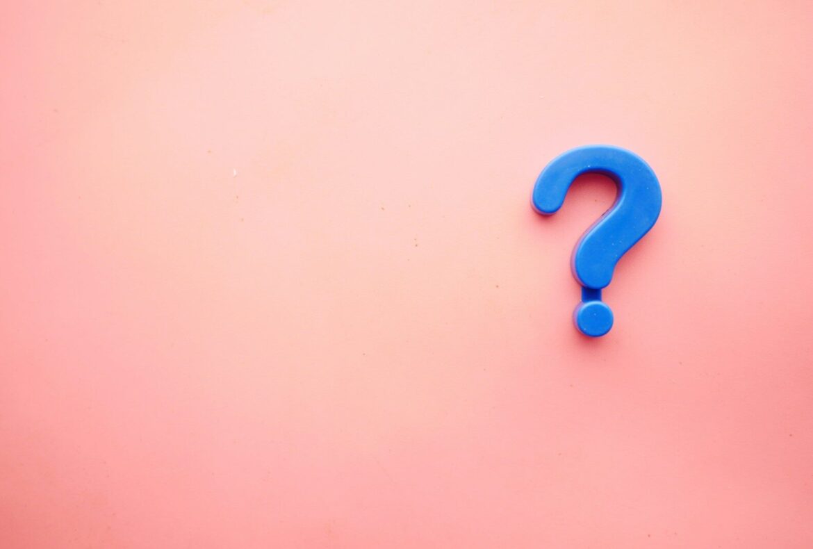 Photo by Towfiqu barbhuiya a blue question mark on a pink background